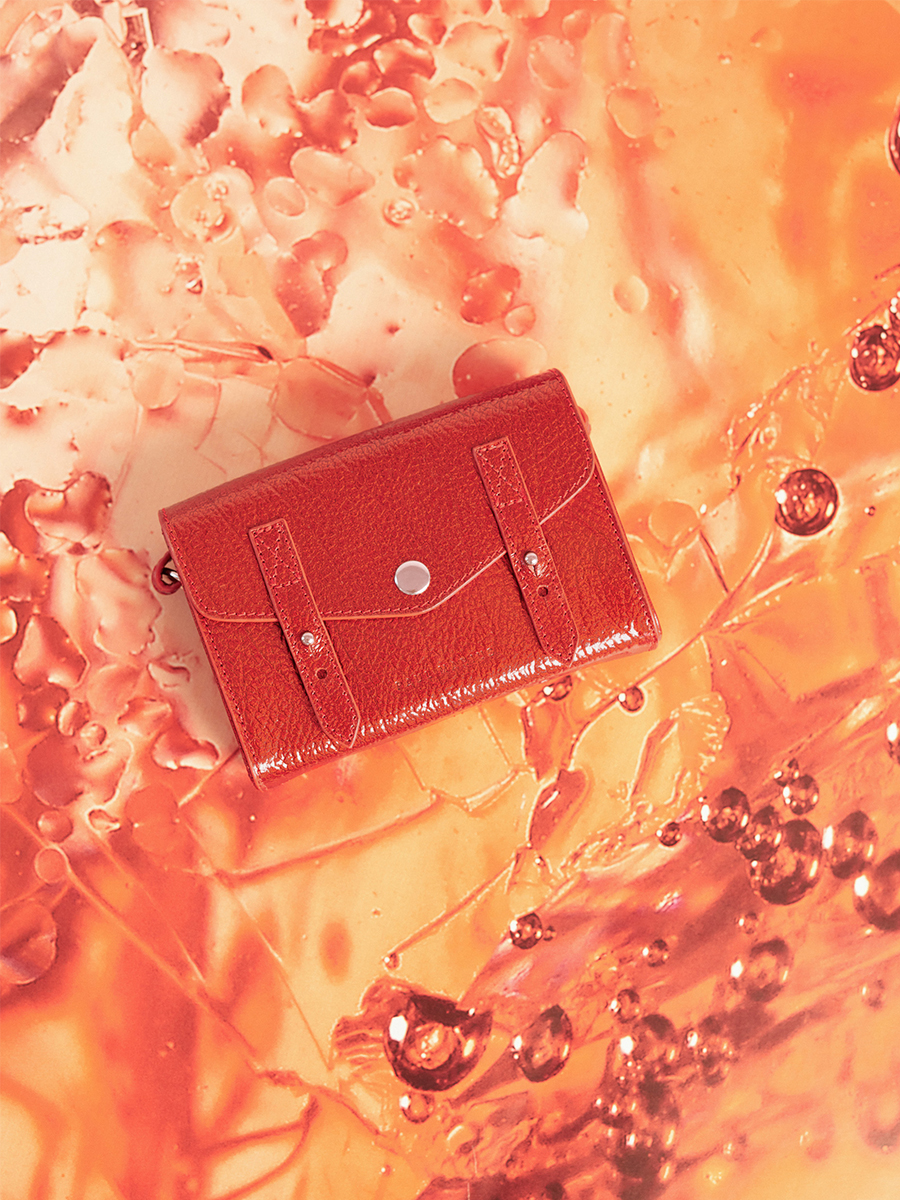 Small red leather crossbody bag LeMini Indispensable - Star Flame ambient view