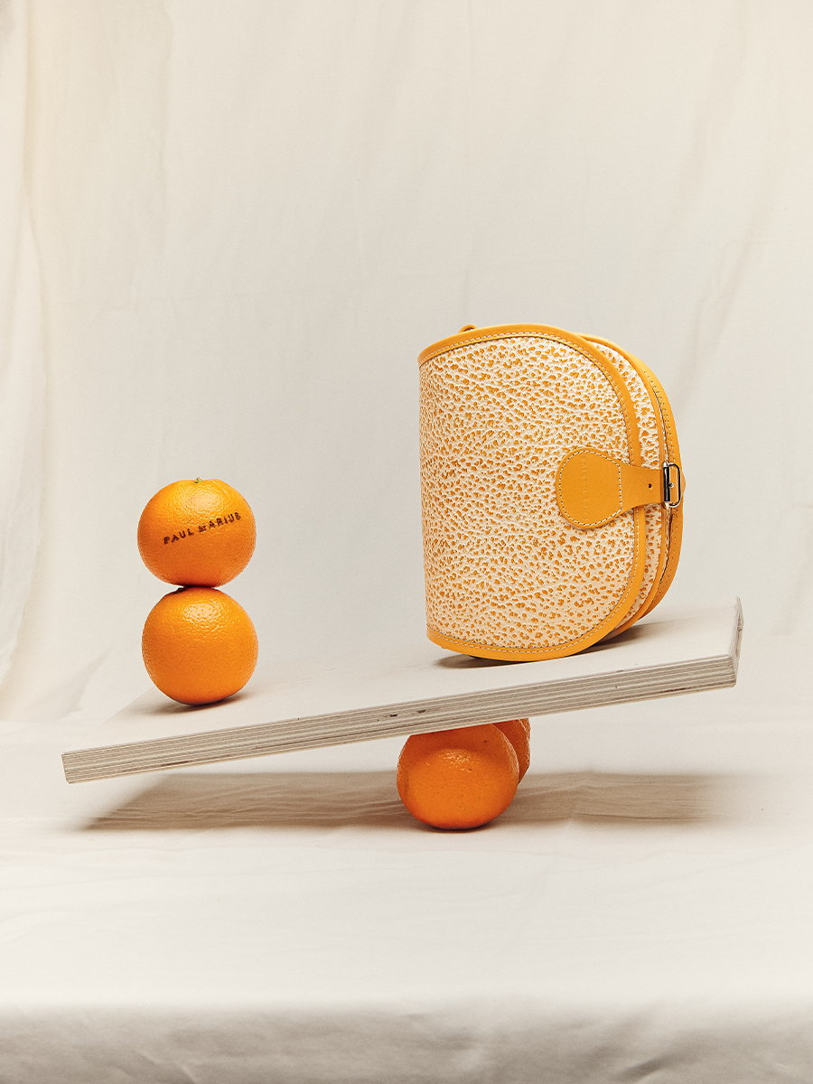 Orange leather crossbody bag LeBohémien - Orangeade ambient view