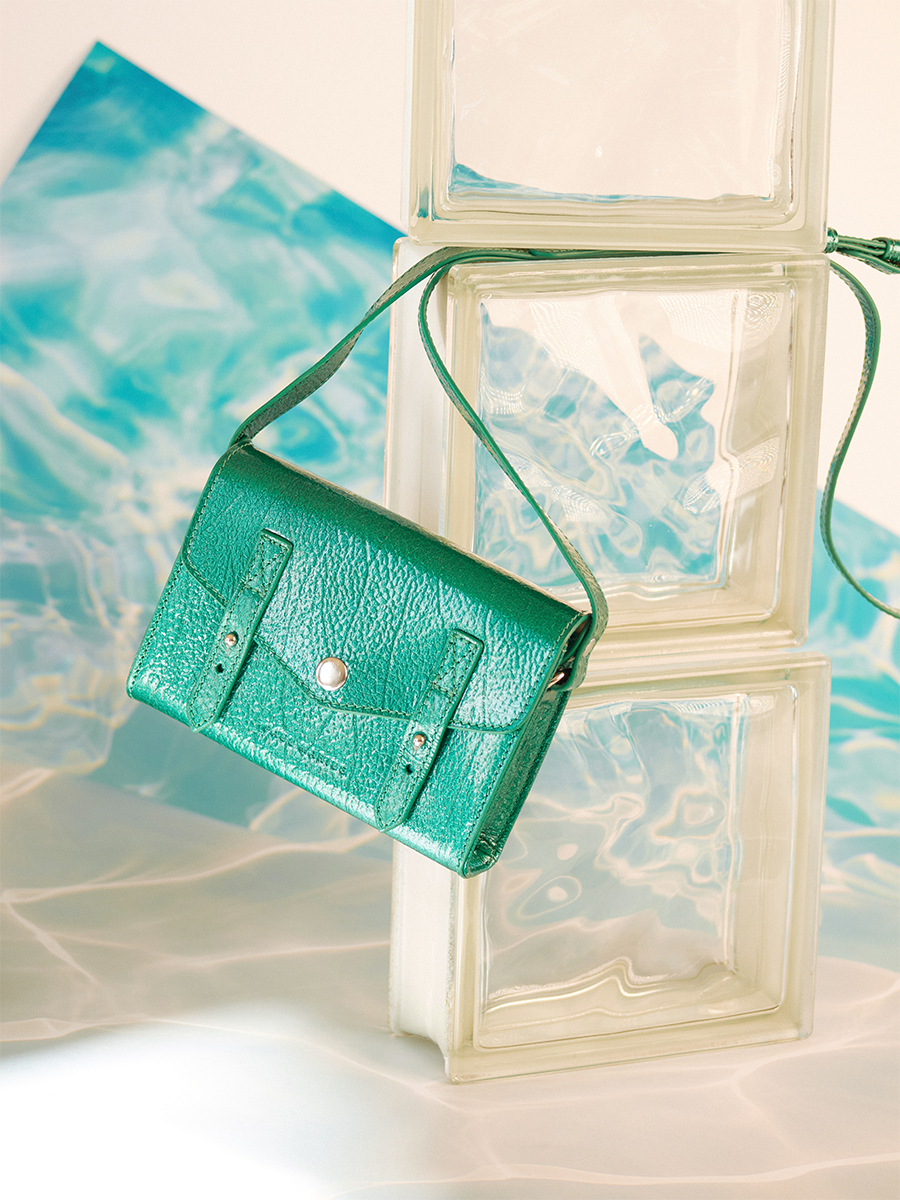 Small blue leather crossbody bag LeMini Indispensable - Lagoon Star focus material photo